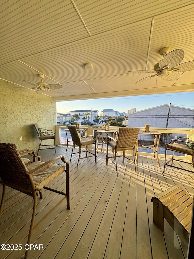 wooden deck with ceiling fan