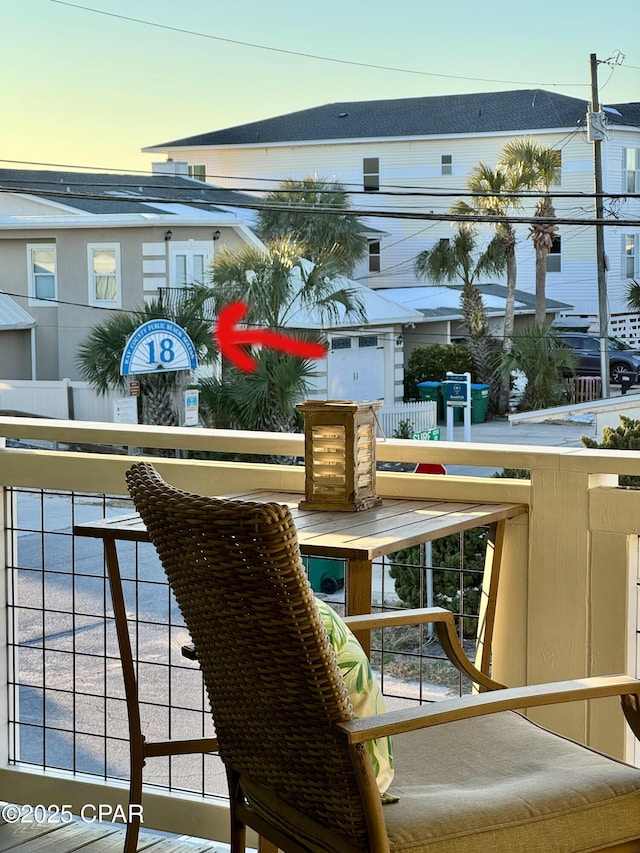 view of balcony at dusk