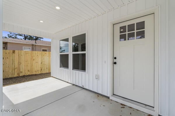 property entrance with a patio area