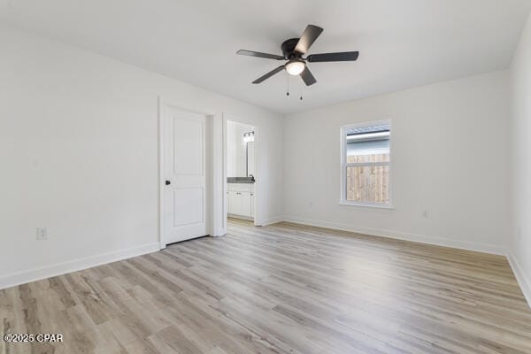 unfurnished room featuring light hardwood / wood-style floors and ceiling fan