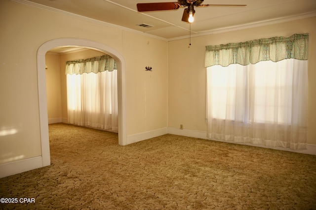 carpeted empty room featuring ornamental molding and ceiling fan