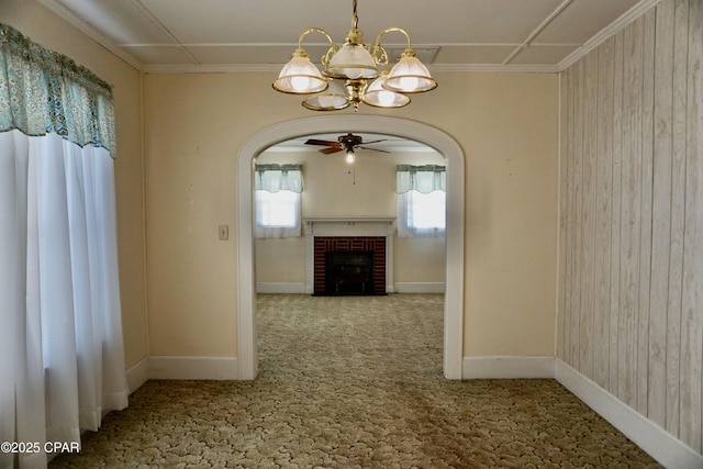 corridor featuring carpet floors and an inviting chandelier