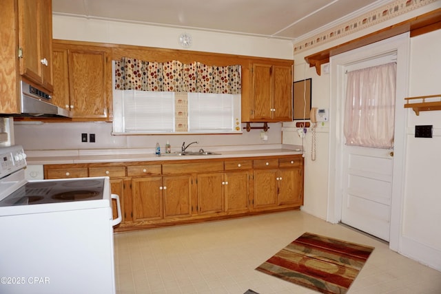 kitchen featuring extractor fan, sink, and white range with electric stovetop