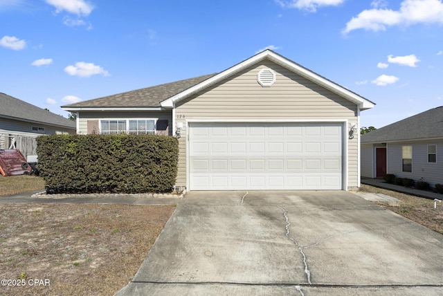 ranch-style house featuring a garage