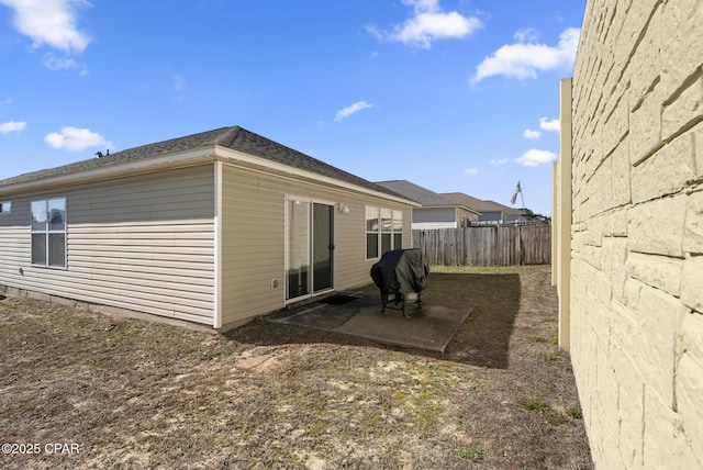 view of side of home featuring a patio area