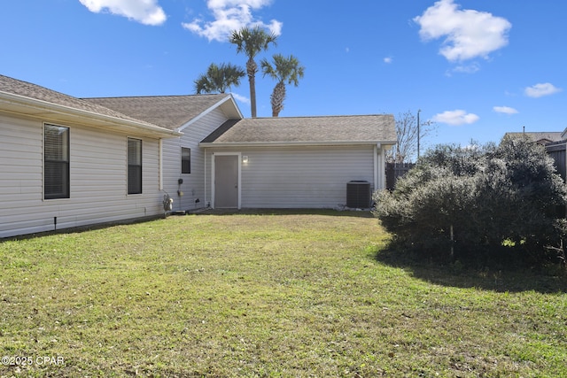 exterior space featuring a yard and central AC