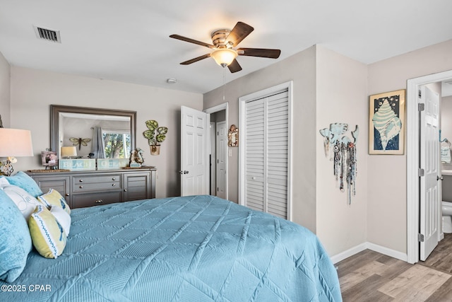 bedroom featuring ceiling fan, a closet, and light wood-type flooring