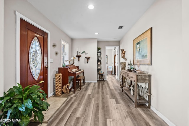 foyer with light wood-type flooring