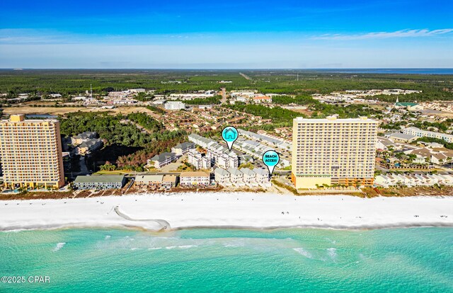 bird's eye view with a water view and a beach view