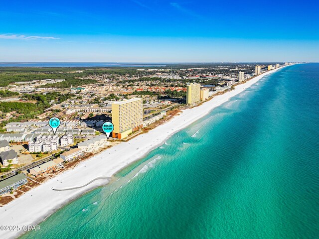 drone / aerial view featuring a view of the beach and a water view