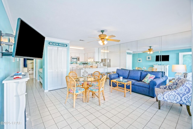 tiled living room featuring ceiling fan