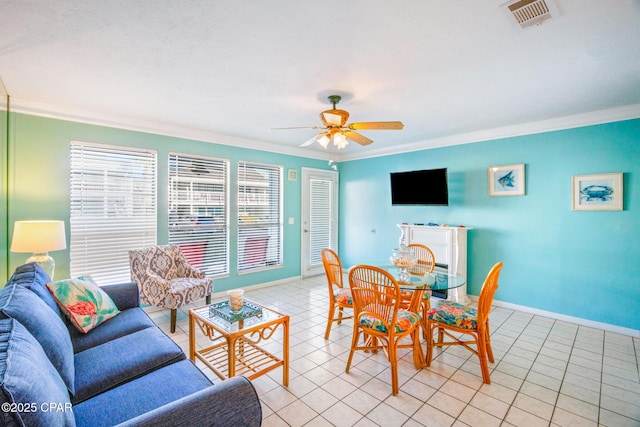 interior space featuring ceiling fan and ornamental molding