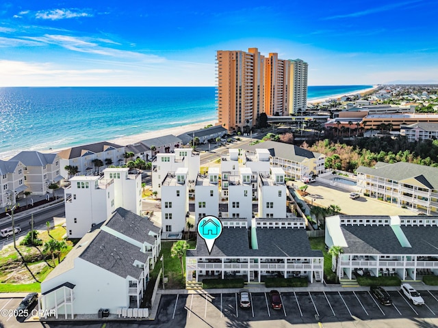 birds eye view of property featuring a water view and a view of the beach