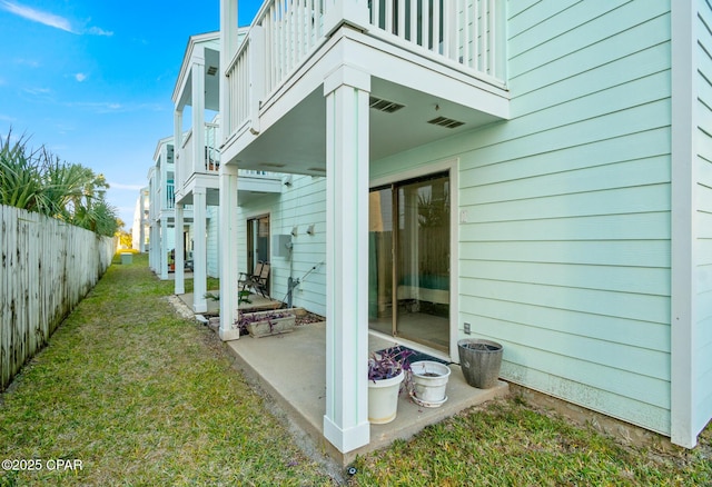 exterior space with a balcony and a yard