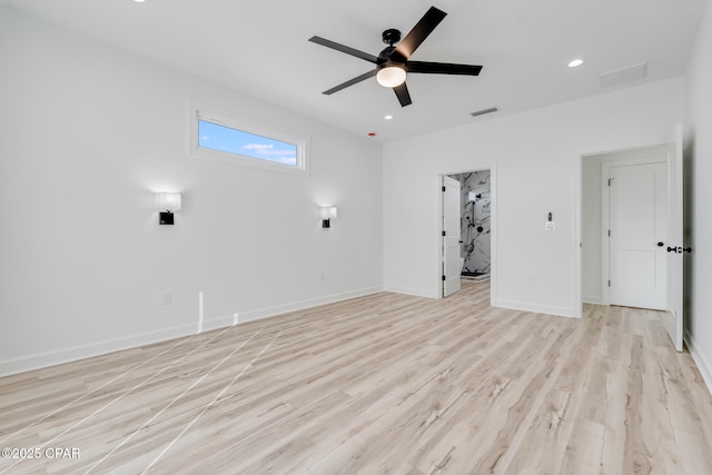 empty room featuring light wood-type flooring and ceiling fan