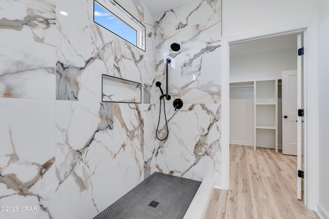 bathroom featuring wood-type flooring and walk in shower