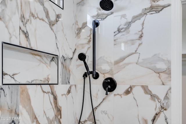 interior details with a tile shower