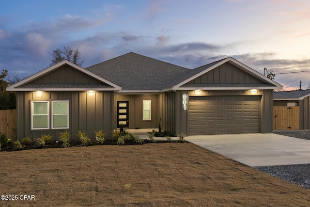 view of front of house featuring a yard and a garage