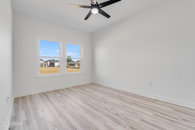 spare room with ceiling fan and light hardwood / wood-style flooring