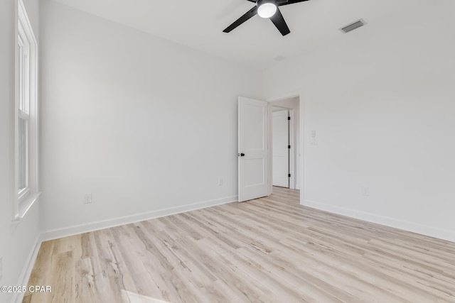 spare room with light hardwood / wood-style floors and ceiling fan