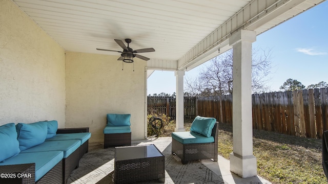 view of patio / terrace featuring ceiling fan and an outdoor living space