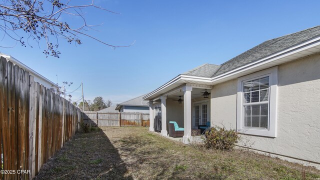 view of yard featuring ceiling fan