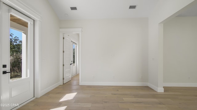 unfurnished room with light hardwood / wood-style flooring