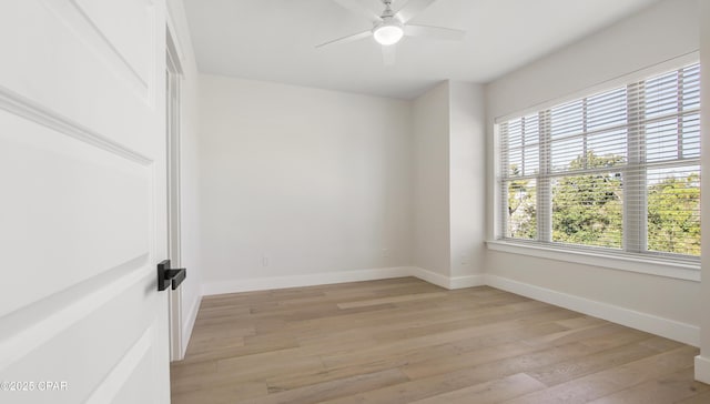 unfurnished room with ceiling fan and light hardwood / wood-style flooring