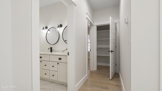 3511 Cottage Cove Ln, Panama City, FL 32408 - corridor featuring baseboards and a sink