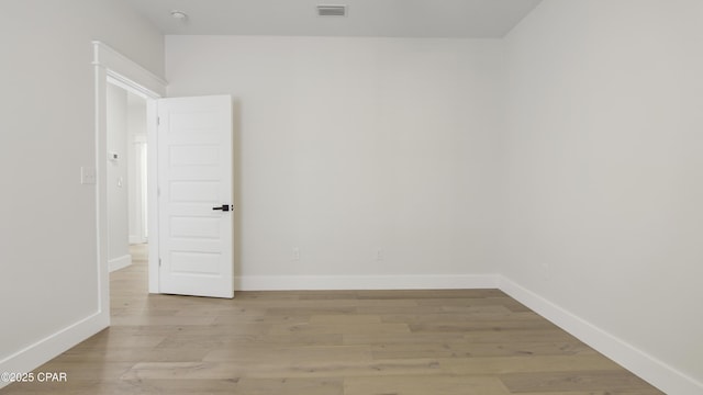 unfurnished room featuring light wood-type flooring