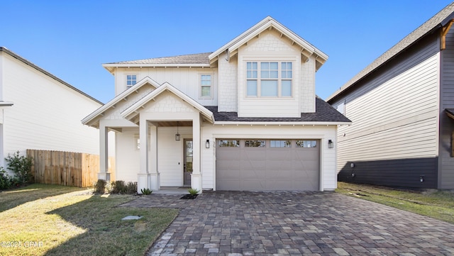 3511 Cottage Cove Ln, Panama City, FL 32408 - view of front of home with decorative driveway, a garage, and a shingled roof