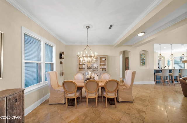 dining area with baseboards, visible vents, arched walkways, crown molding, and a notable chandelier