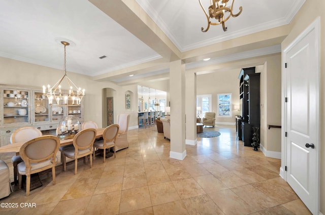 dining room with crown molding, light tile patterned floors, baseboards, and a notable chandelier