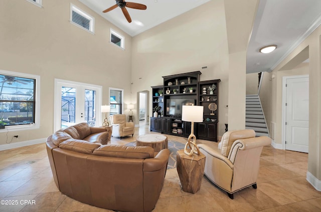 living area with ornamental molding, french doors, baseboards, and stairs