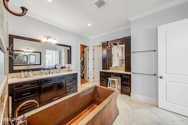 full bathroom featuring tasteful backsplash, visible vents, ornamental molding, vanity, and tile patterned floors