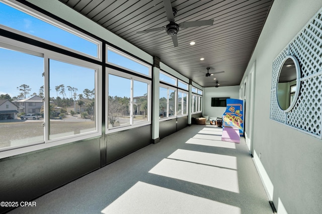 sunroom with a ceiling fan