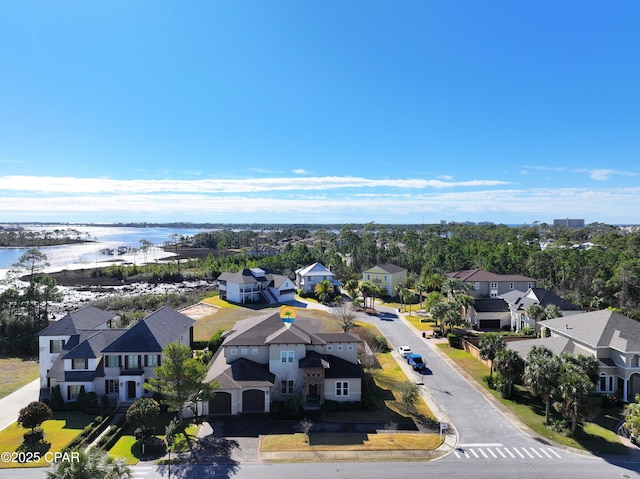 birds eye view of property featuring a water view and a residential view