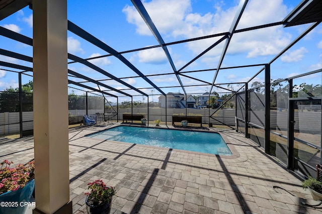 view of pool featuring a patio and a lanai