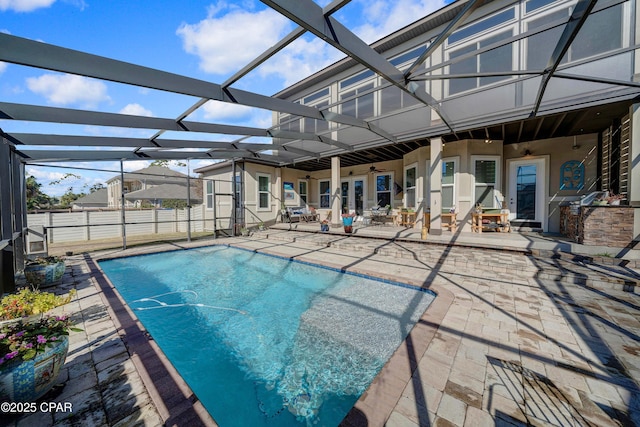 pool featuring a lanai and a patio