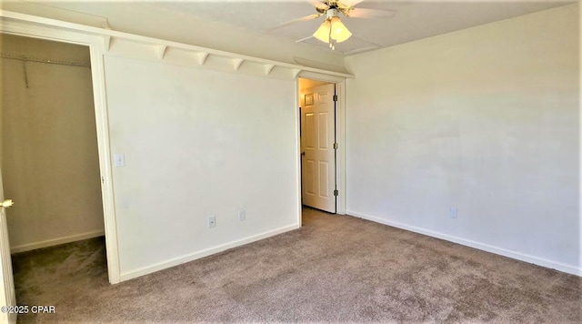 unfurnished bedroom with ceiling fan, carpet flooring, and baseboards