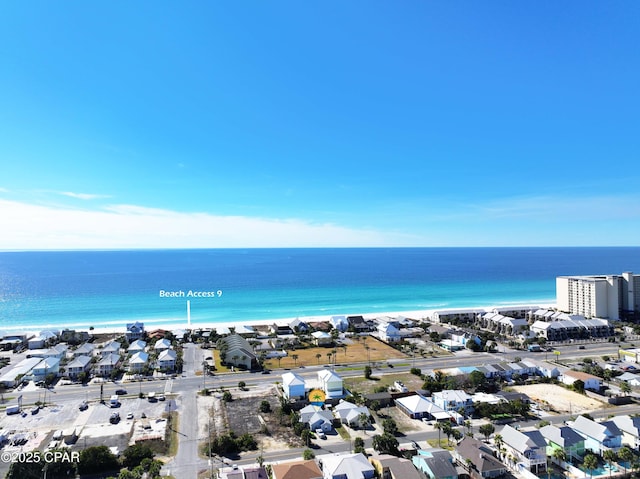 aerial view with a water view, a residential view, and a beach view