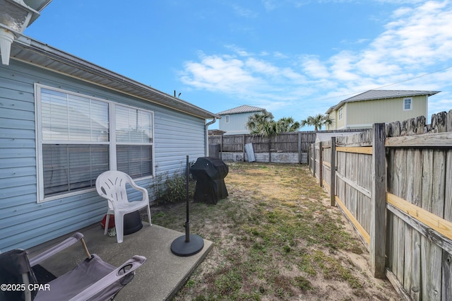 view of yard with a fenced backyard