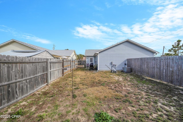 view of yard featuring a fenced backyard and cooling unit