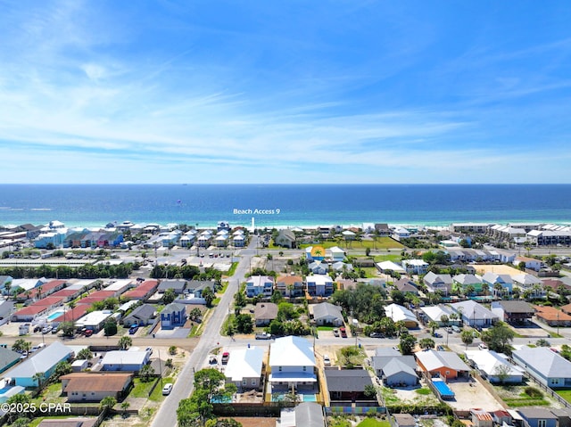 drone / aerial view featuring a water view and a residential view