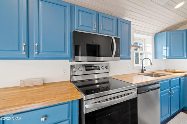 kitchen with sink, blue cabinetry, and stainless steel appliances