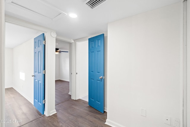 hallway with dark wood-type flooring