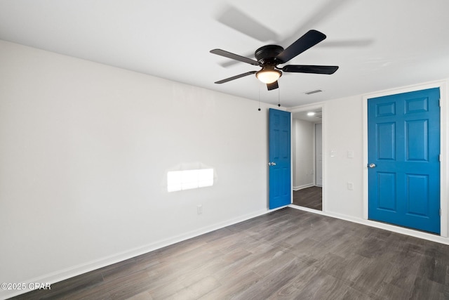 unfurnished bedroom with ceiling fan and hardwood / wood-style flooring