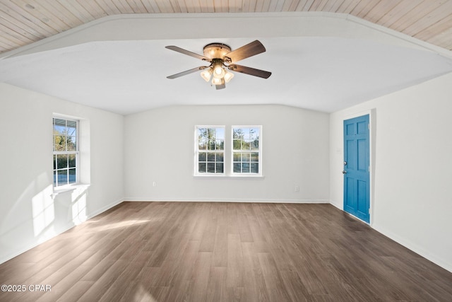 spare room with ceiling fan, dark hardwood / wood-style flooring, lofted ceiling, and plenty of natural light