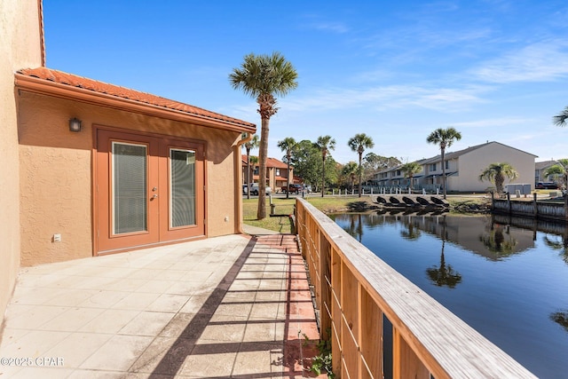 view of patio featuring a water view