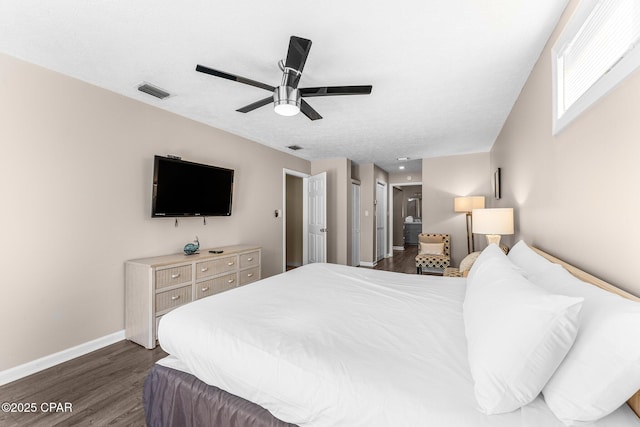 bedroom featuring ceiling fan and dark wood-type flooring